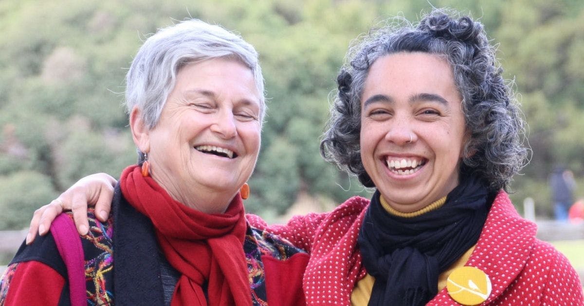 Photo of two women with big smiles