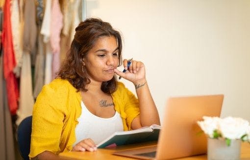 Photo of woman looking at computer
